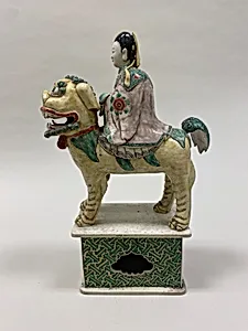 Figure of Bodhisattva Guanyin riding a lion