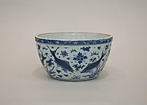 Bowl with fish in pond