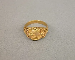 Ring with Oval Bezel and Raised Design of Fish by Unknown Artist