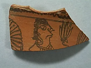 Shard: Head of Offerer with Plant by Unknown Artist