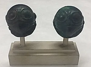 One of a pair of Bird-Head Ornaments