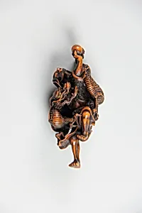 Netsuke of Dragon Coiled around the Body of a Man