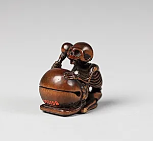 Netsuke of Skeleton with a Drum