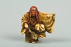 Netsuke of Noh Dancer with Long Red Hair and Peony