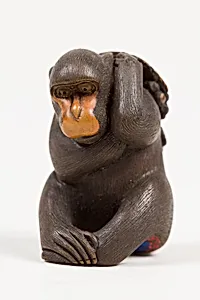 Netsuke of Seated Monkey Carrying a Bunch of Grapes and Leaves by Koichi
