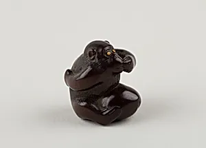 Netsuke of Monkey with One Hand over Mouth, the Other Behind His Back by Miwa