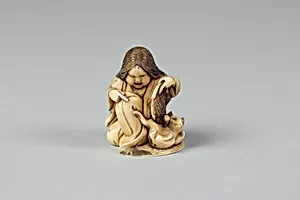 Netsuke of Girl Playing with a Cat