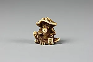 Netsuke of Monkey with Lotus Leaf Hat