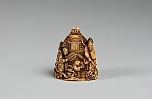 Netsuke in the form of a Bell Ornamented with Waves and Figures