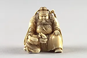 Netsuke of Shoki Holding a Demon by a Cord by Unknown Artist