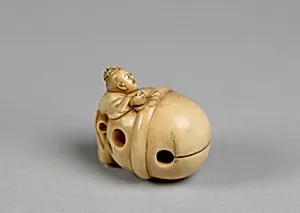 Netsuke in the form of a Bell with a Boy
