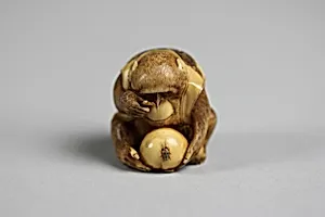 Netsuke of Monkey Looking at a Fly through a Magnifying Glass