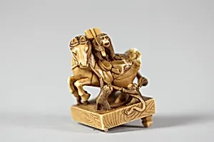 Netsuke of a Horse on a Pedestal with Monkeys Playing About