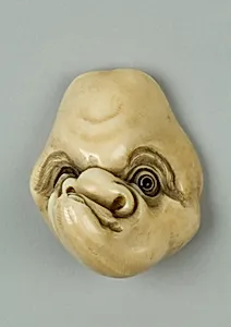 Netsuke of Mask with Man's Lopsided Face