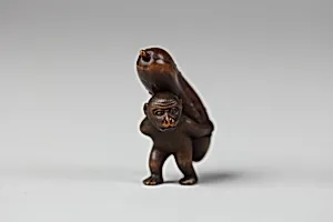 Netsuke of Monkey Carrying a Cucumber on His Back