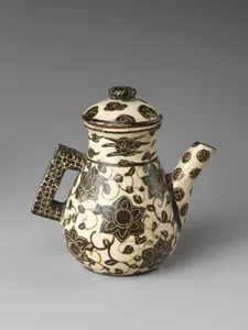 Spouted pouring vessel