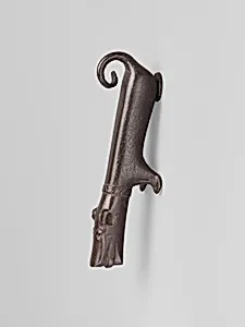 Door knocker in the shape of a small dog