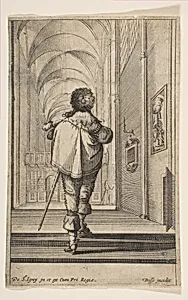 A gentleman seen from behind walking into a church