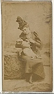 [Actress cradling small dog], from the Actors and Actresses series (N145-8) issued by Duke Sons & Co. to promote Duke Cigarettes by W. Duke, Sons & Co.|American Tobacco Company