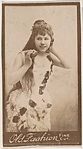 Actress holding apple, from the Actresses series (N664) promoting Old Fashion Fine Cut Tobacco