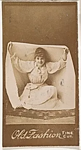 Actress holding part of skirt above head, from the Actresses series (N664) promoting Old Fashion Fine Cut Tobacco