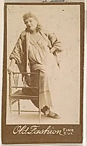Actress leaning against chair, from the Actresses series (N664) promoting Old Fashion Fine Cut Tobacco