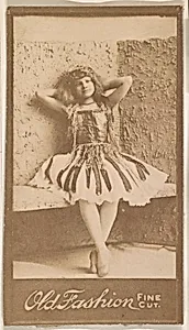Actress leaning against wall with hands behind head, from the Actresses series (N664) promoting Old Fashion Fine Cut Tobacco