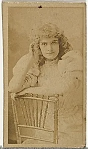 [Actress posing on chair], from the Actors and Actresses series (N145-8) issued by Duke Sons & Co. to promote Duke Cigarettes by W. Duke, Sons & Co.|American Tobacco Company