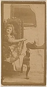 Actress posing on chair with legs resting on armrest, from the Actresses series (N664) promoting Old Fashion Fine Cut Tobacco