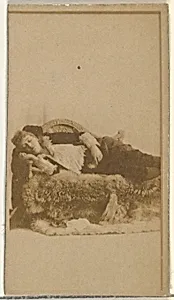 [Actress reclining on furs], from the Actors and Actresses series (N145-8) issued by Duke Sons & Co. to promote Duke Cigarettes by American Tobacco Company|W. Duke, Sons & Co.