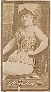 Actress seated in chair, from the Actresses series (N664) promoting Old Fashion Fine Cut Tobacco