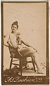 Actress seated in chair, from the Actresses series (N664) promoting Old Fashion Fine Cut Tobacco