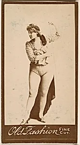 Actress standing with arm aloft, from the Actresses series (N664) promoting Old Fashion Fine Cut Tobacco