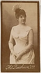 Actress wearing feathered headpiece, from the Actresses series (N664) promoting Old Fashion Fine Cut Tobacco