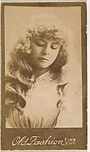 Actress with long wavy hair looking down, from the Actresses series (N664) promoting Old Fashion Fine Cut Tobacco