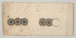 Banknote motif: two bands of ornamental lathe work resembling florets and hexagons