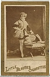 Minnie Palmer (standing beside chair), from the Actresses and Celebrities series (N60, Type 1) promoting Little Beauties Cigarettes for Allen & Ginter brand tobacco products by Allen & Ginter
