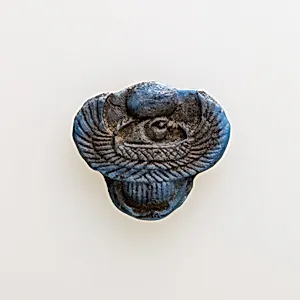 Amulet of winged scarab with falcon head