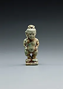 Amulet: Pataikos astride crocodiles and with a scarab on his head