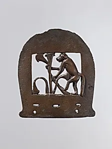 Ax head with monkey figure
