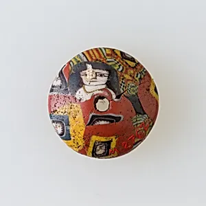 Bead with face canes