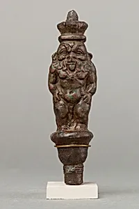 Bes standing on a papyriform capital, Beset on opposite side