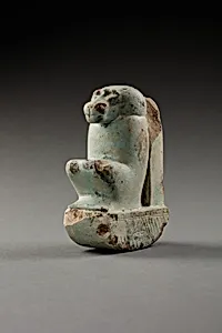 Figure of baboon on a basket and with a pillar, the shebet offering