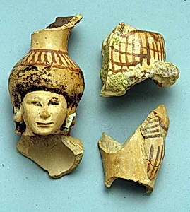 Fragments of a vase in the form of a woman holding a basket