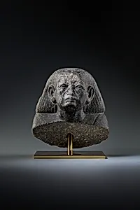 Head and shoulders of a male statue by Unknown Artist