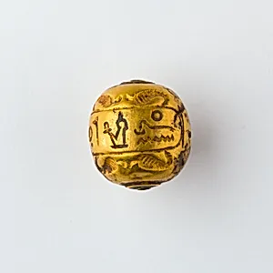 Hollow spherical bead with the Names of Ramesses II and Queen Isetnefret