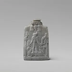 Miniature Cippus (magical stela) with Horus in profile wearing gazelle head on the forehead