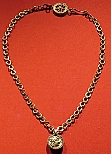 Necklace with a beaded wire wheel and a pendant with a profile of Alexander (?)