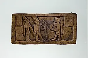 Part of a bronze statue base inscribed in Egyptian and Greek