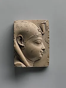 Plaque with bust of a divine child with earring (Ihy?)